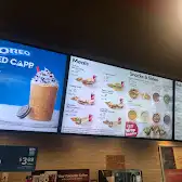 Tim Hortons storefront and interior at 250 Bloor St East., Toronto, ON