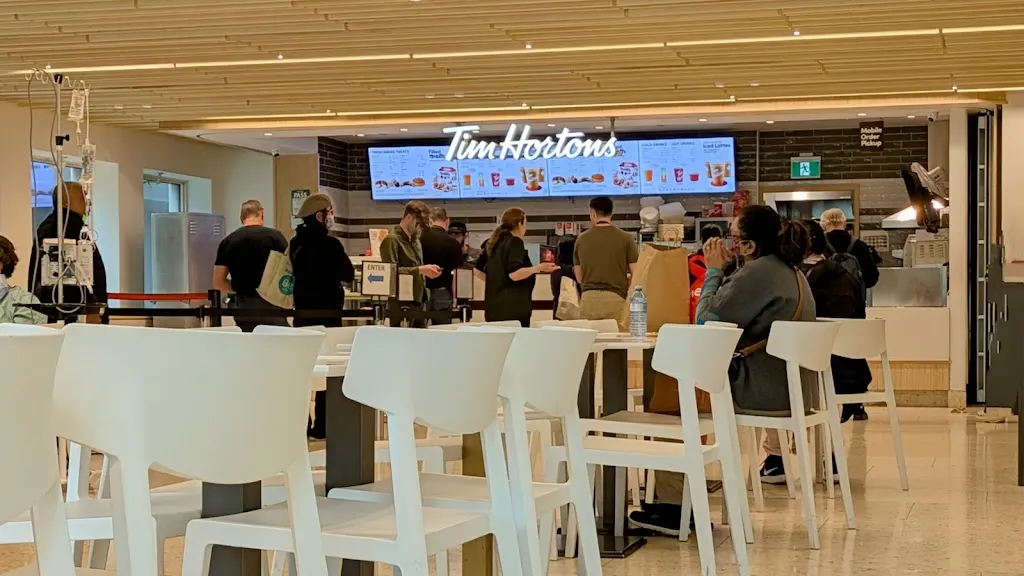Tim Hortons storefront and interior at 610 University Ave, Toronto, ON