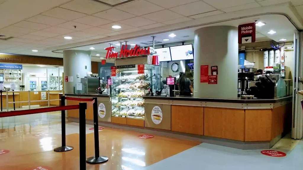 Tim Hortons storefront and interior at 657 University Ave, Toronto, ON