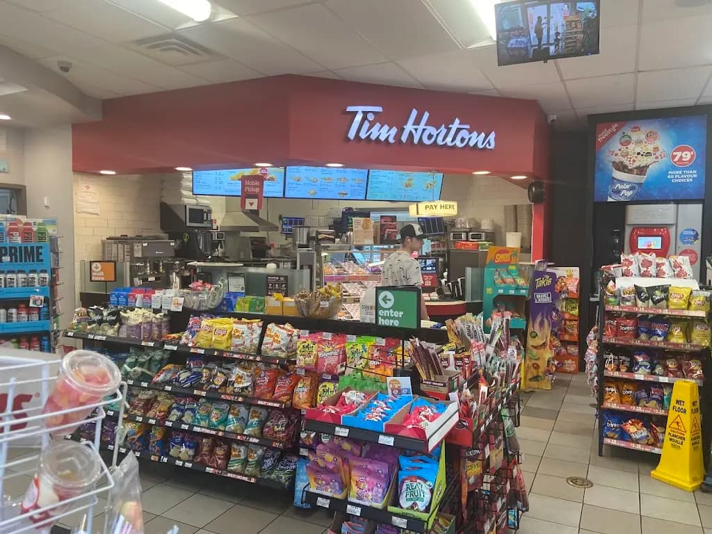 Tim Hortons storefront and interior at 1 Thornhill Woods Dr, Vaughan, ON