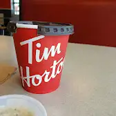 Tim Hortons storefront and interior at 3803 Millar Ave, Saskatoon, SK