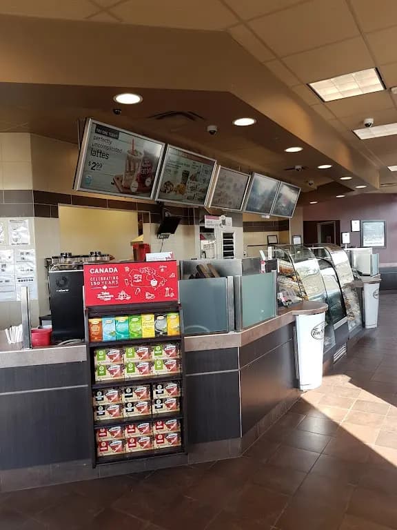 Tim Hortons storefront and interior at 101 Central St East, Warman, SK